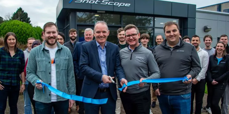People cutting a rope to officially open the new headquarters