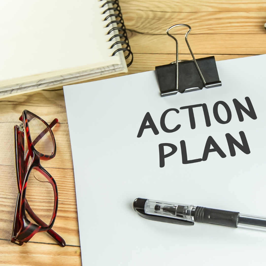 Clipboard with action plan written on it