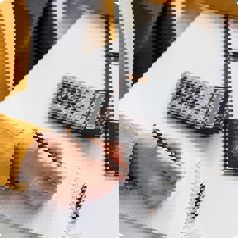 Person with Calculator and Notes