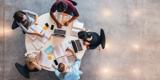 Highly Skilled People sitting around a table working